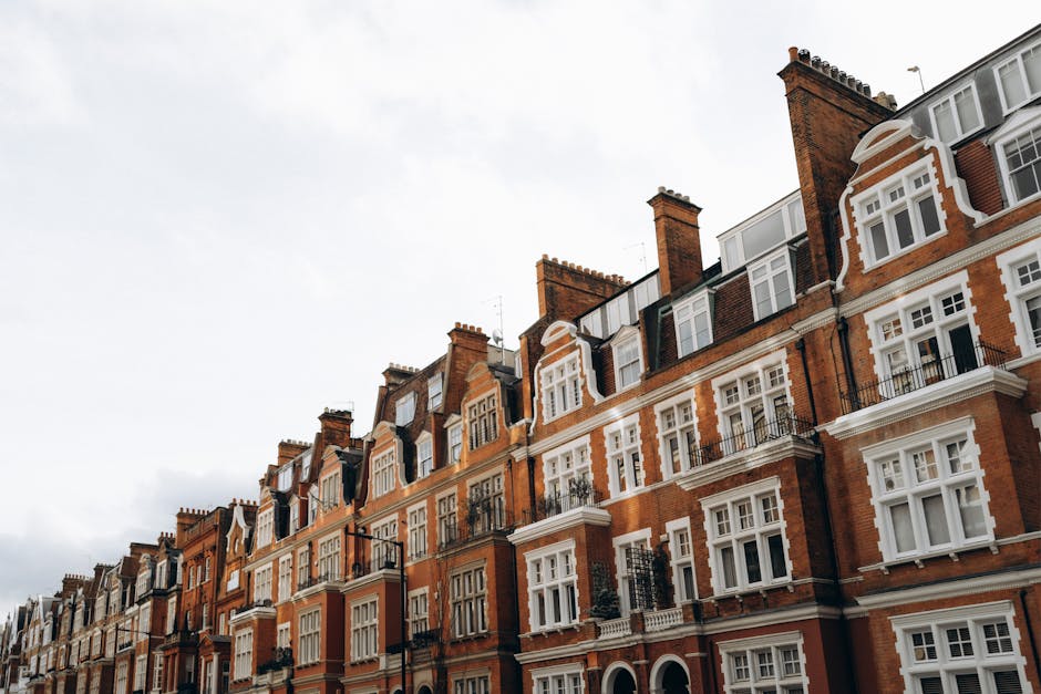 Classic red brick terraced houses in a residential district of London, UK.