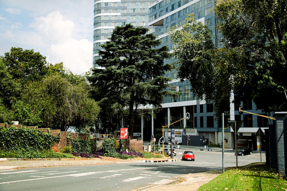 A bustling street scene in Sandton, Gauteng, featuring modern skyscrapers and vibrant urban life.